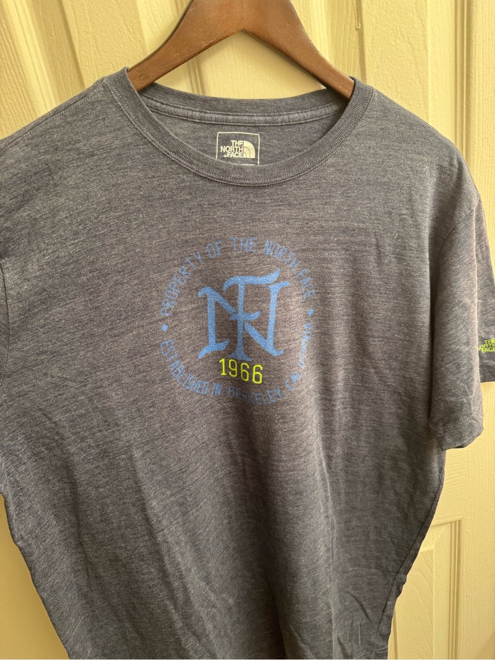 The North Face Men's Gray Short-Sleeve Tee with Blue Logo and Yellow Detail